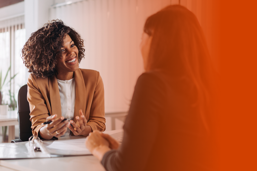 Female manager talking to a worker in an office